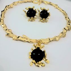 A set of Gold with black stone necklace and matching stud earrings gift