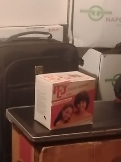 12 boxes of ,PCJ WITH NUTRIENT SHEEN. HAIR RELAXER
