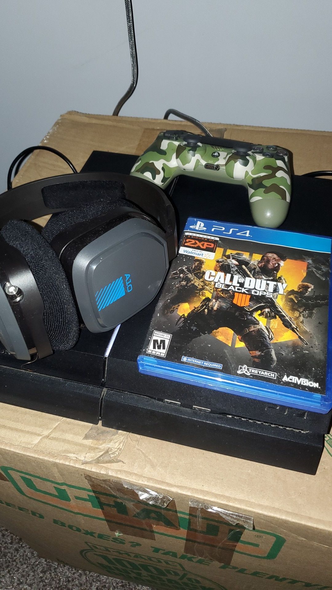Ps4 with controller, astro 10 headset and bo4 game.