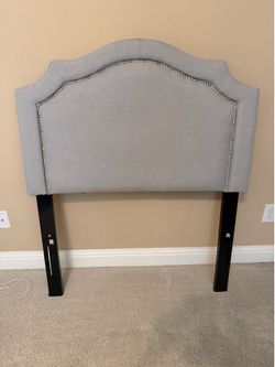 Twin bed with mattress/boxsprings and headboard.