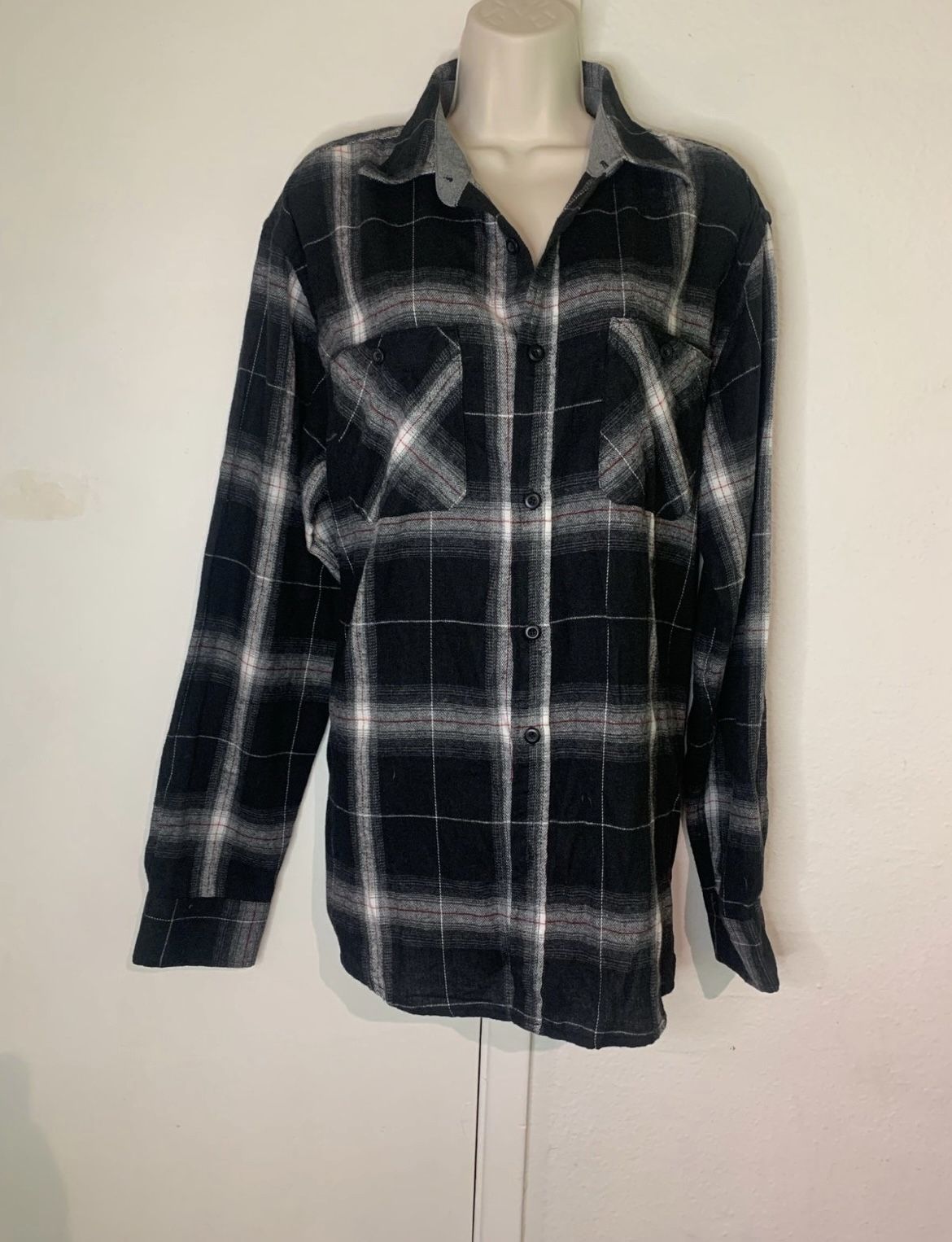 Black plaid button down long sleeve shirt size large.   (T)