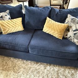 2 sofas with pillows