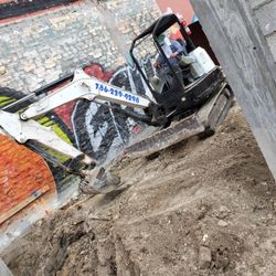 Excavator And Bobcat