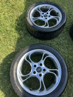 Two Tires With Rims .