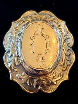 $10. Vintage scroll locket brooch. 1.75 inches long. 1.25 inches wide.