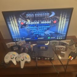 N64 Bundle Nintendo 64 Console, 32” TV, 7 Games, 3 Controllers, 1 Controller Pak, & RCA to HDMI Adapter