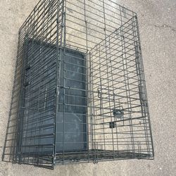 Metal wire dog kennel on wheels