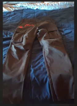 Tactical cargo pants with patches on them