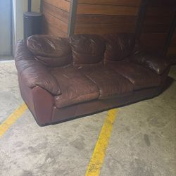 Leather Couch. Damage. MUST PICK UP