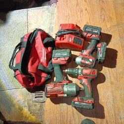 Milwaukee Drill And 1/4 Inch Impact Combo Plus 1/2 Inch Impact Wrench 4 Batteries Charger And Milwaukee Tool Bag