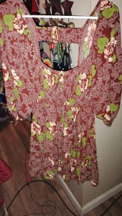 New with tags Women's Floral Mini Dress with open back.