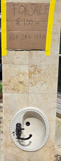 Tiled Bathroom Vanity with Porcelain sink and Moen faucet