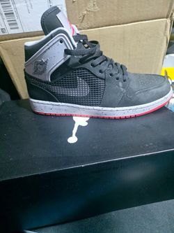Nike Air Jordan 1 Retro '89 sneakers in the "Black Fire Red Cement" colorway.