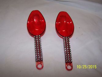 Red plastic candy scoops decorated with rhinestone