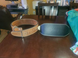 HIS AND HERS GOOD CONDITION WEIGHT BELTS.