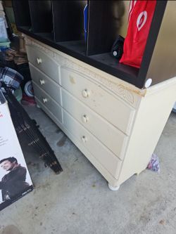 dresser and black shelf