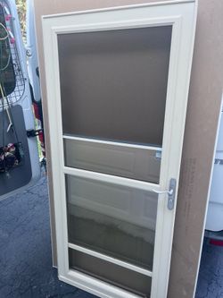 Used 36” Cream Larson Storm Door with Screen