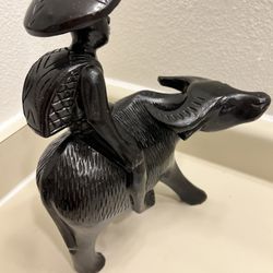 Vintage carved wooden figurine of an Asian man riding a water buffalo, in very good condition, 12.1/2 inches tall