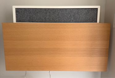 Space-saving wall-mounted fold-down desk with hidden storage compartment
