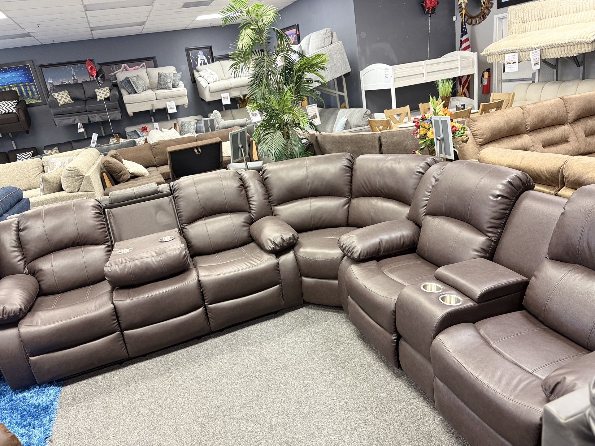 Recliner Sectional With Drop Down Console Available In Black