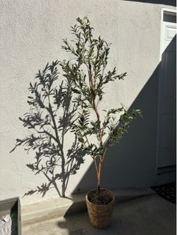 Faux olive tree with basket