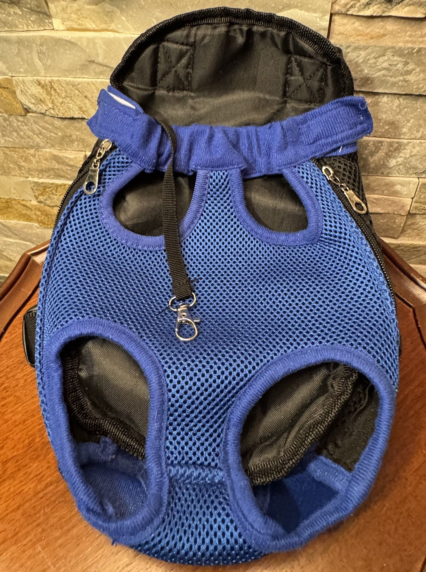 Blue mesh pet carrier backpack designed to carry a small dog or cat with its legs out EUC