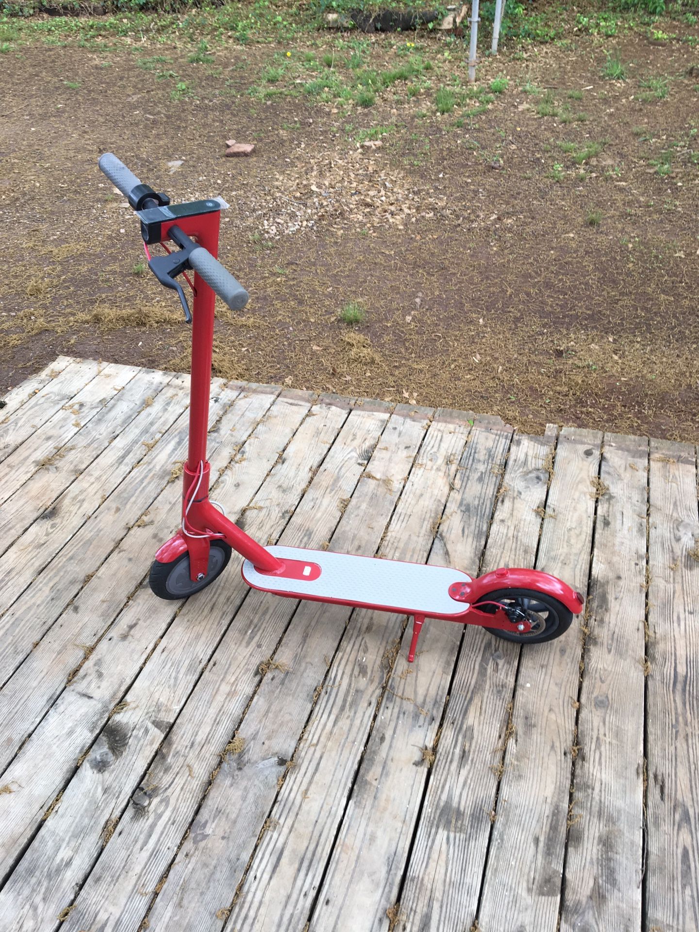 RED Xiaomi M365 scooter with charger and lock