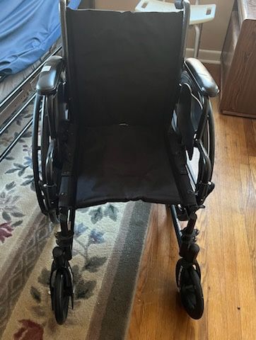 Travel Wheelchair with Leg Extensions and Cushion