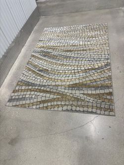 Gray , gold , beige rug .. 7 1/2 x 5 feet $50