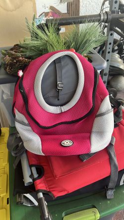 Fur Sport dog backpack carrier in pink and gray.