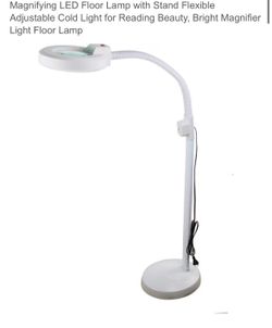 Adjustable skin care/beauty lamp with magnifying lens