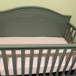Gray baby crib