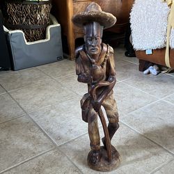 Carved man with cane