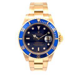 Rolex Submariner 40mm Pre-owned Rolex Submariner. Has a 40mm 18k yellow gold case with a 18k yellow gold oyster bracelet. Features a blue dial and blu