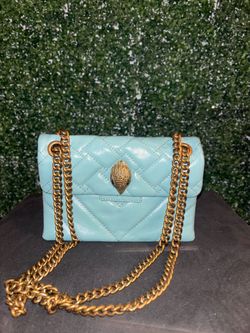 Blue quilted leather crossbody bag with gold hardware