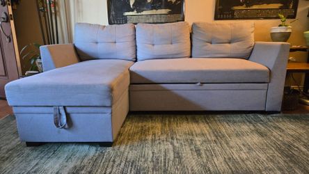 Grey sectional sofa bed with storage