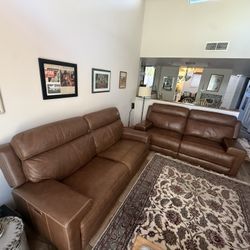 Two leather power reclining coaches