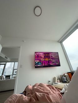 55 Inch Roku TV pristine condition and 360 wall mount