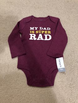 BRAND NEW: Carter’s onesie in size 18 Months
