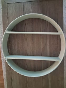 Light blue circular shelf
