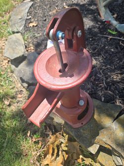 Hand operated cast iron water pump