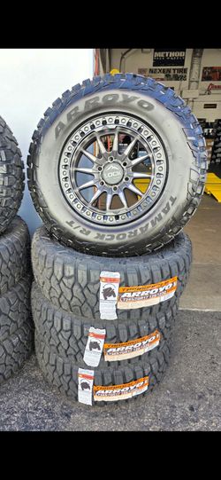 17" LOCK  Gunmetal w/ black lip w- 33" tires