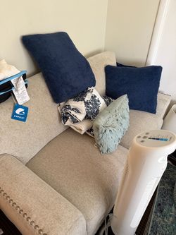 Cream/Beige Upholstered Loveseat with Nailhead Trim — $150