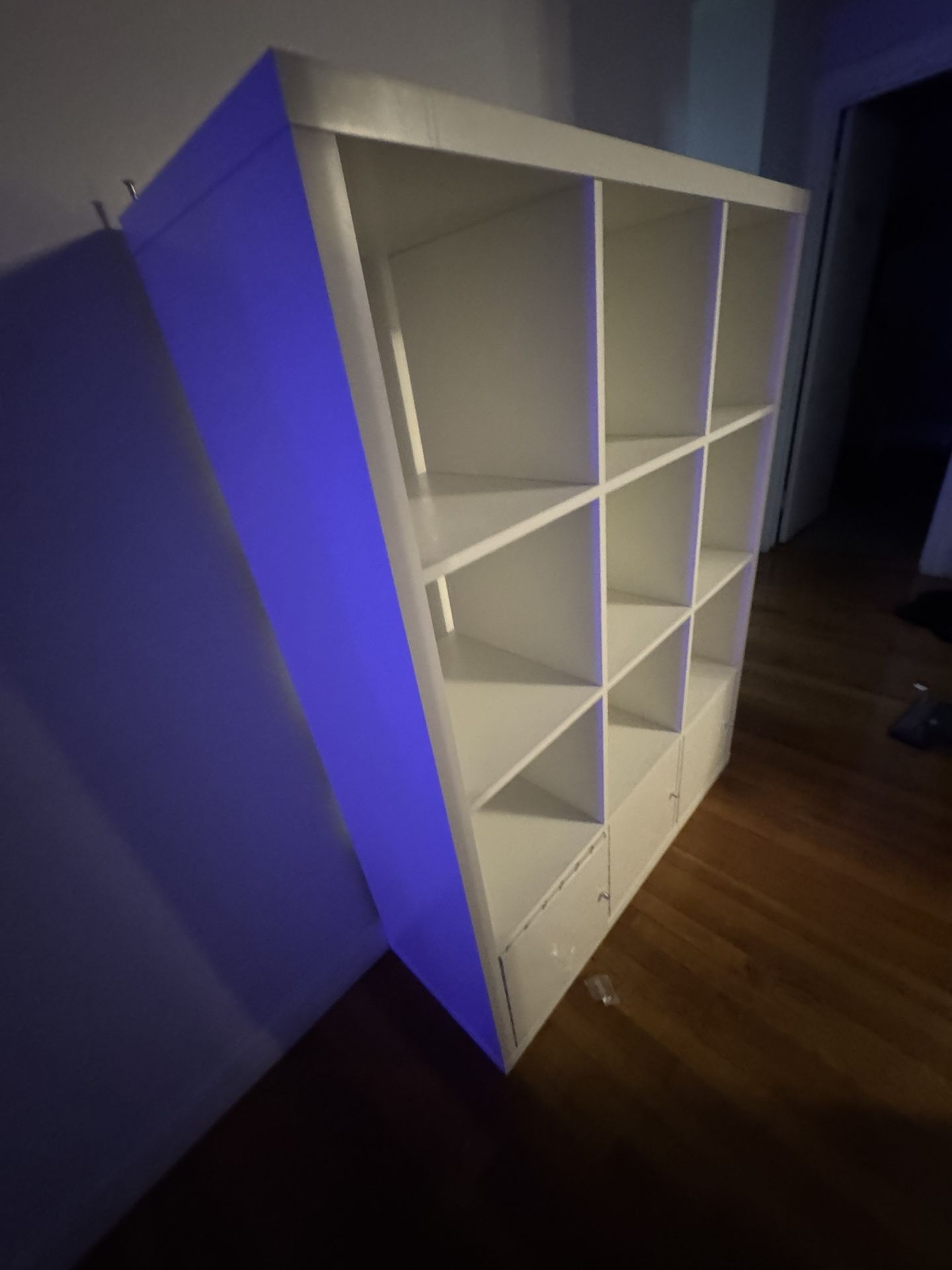 white cabinet with 3 doors and storage