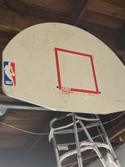 Vintage 1990s Huffy Pro Shot Fiberglass ProShot fan-shaped basketball backboard with an official NBA logo sticker