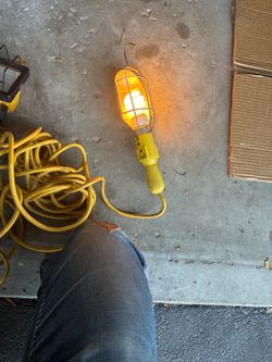 ellow Multi-Purpose Work Light 24ft Cord with Built in Extension Outlet
