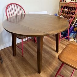 Wooden Table and Red Chairs