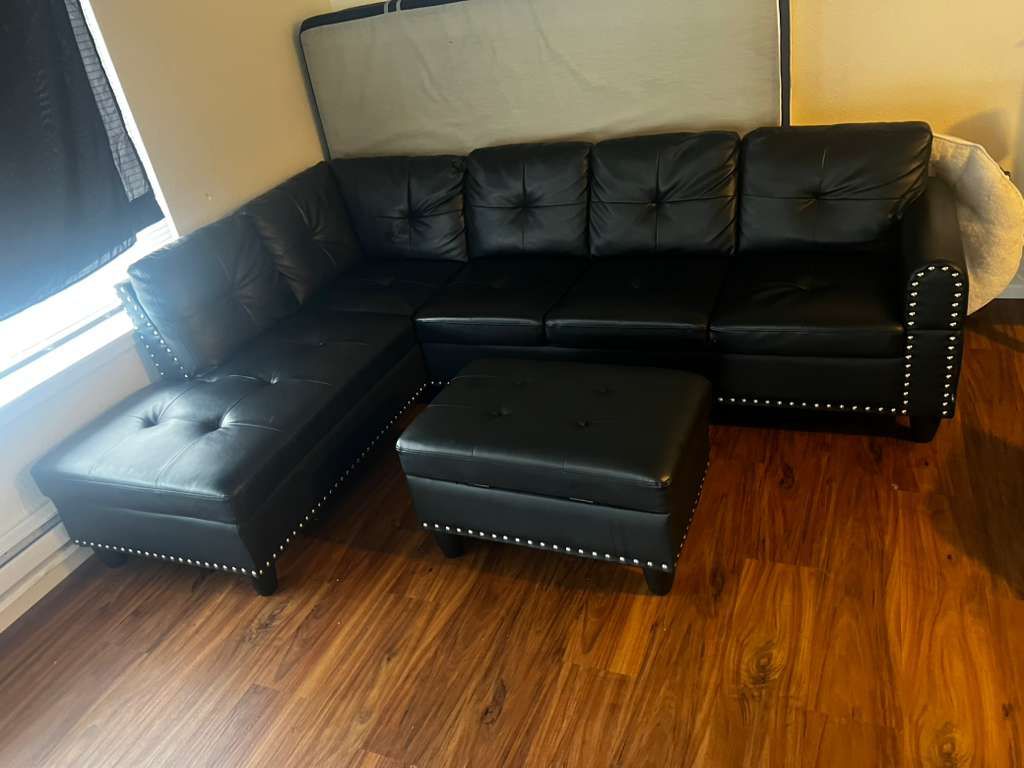 Black leather section couch