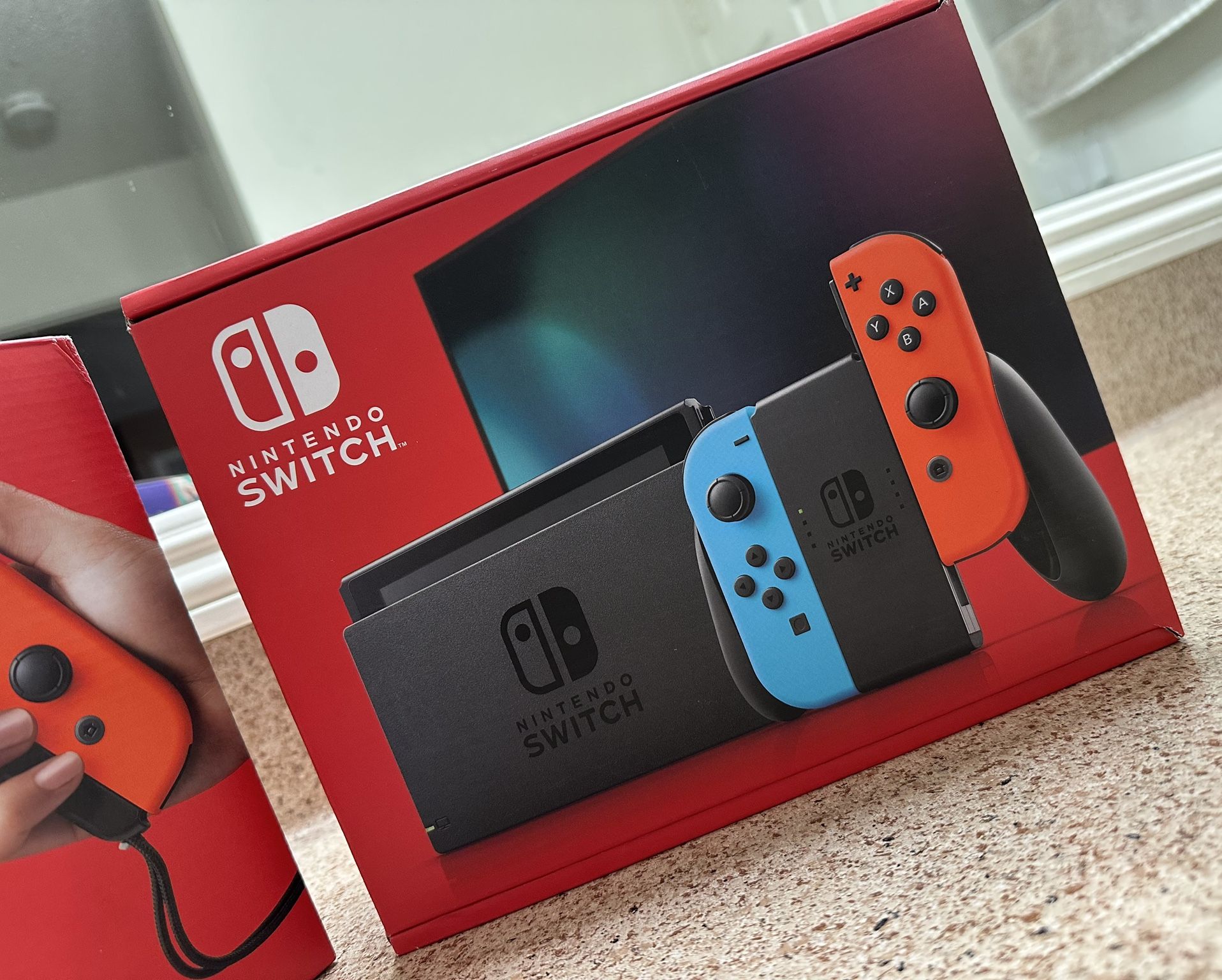 Nintendo Switch with Neon Blue and Neon Red Joy-Con