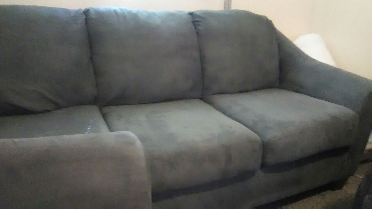 Ashley couch and loveseat, 2 years old excellent condition gunmetal gray.